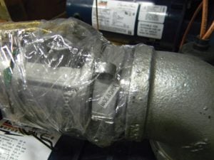 Wrap plastic wrap tightly around a potential air leak path (union joint or cam fitting), turn pump on. If an air leak exists, the plastic wrap will tighten to the area.